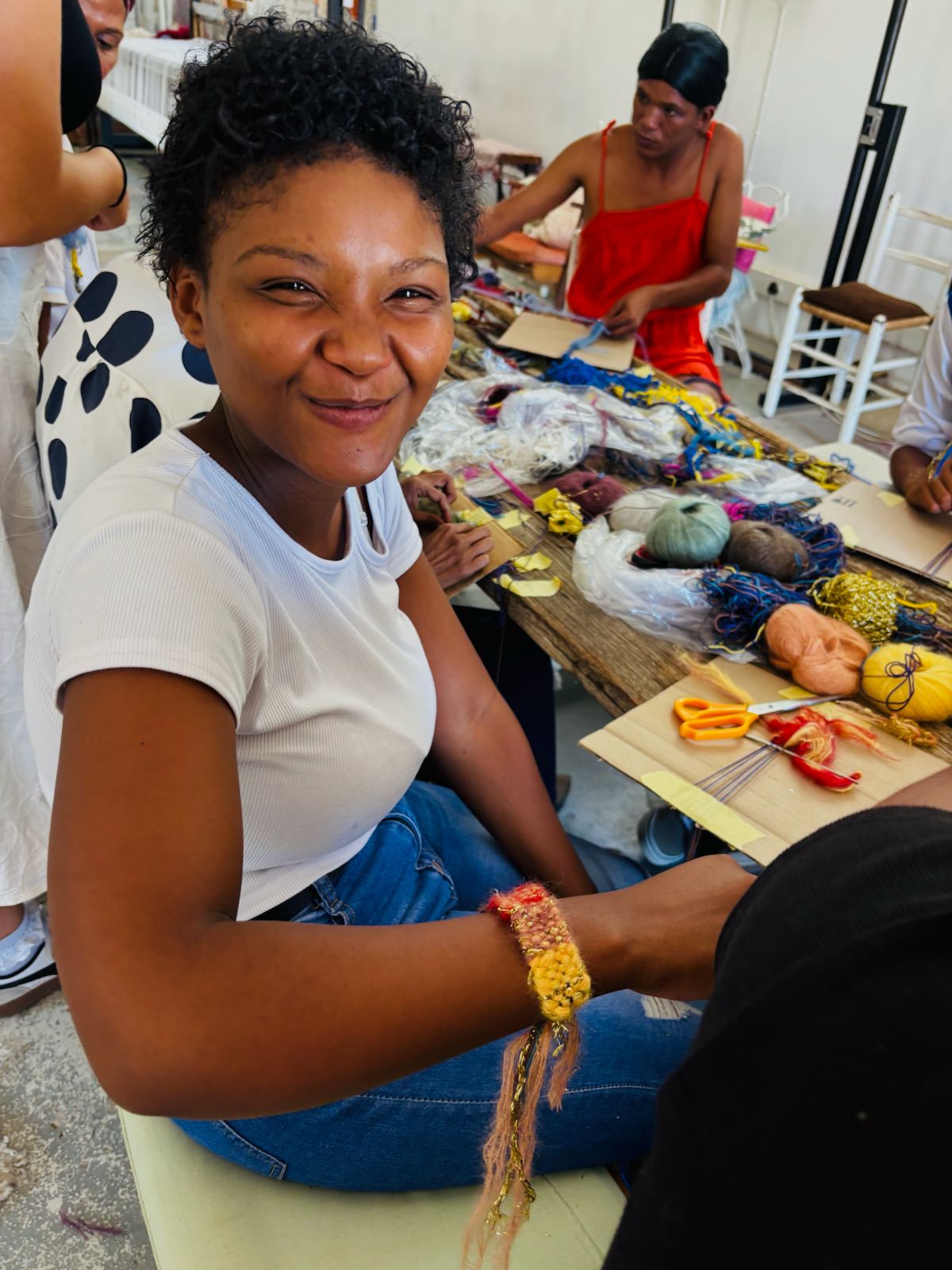 A young creative weaving mohair at a Frances van Hasselt Studios workshop